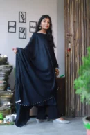 Woman in black Anarkali with dupatta.