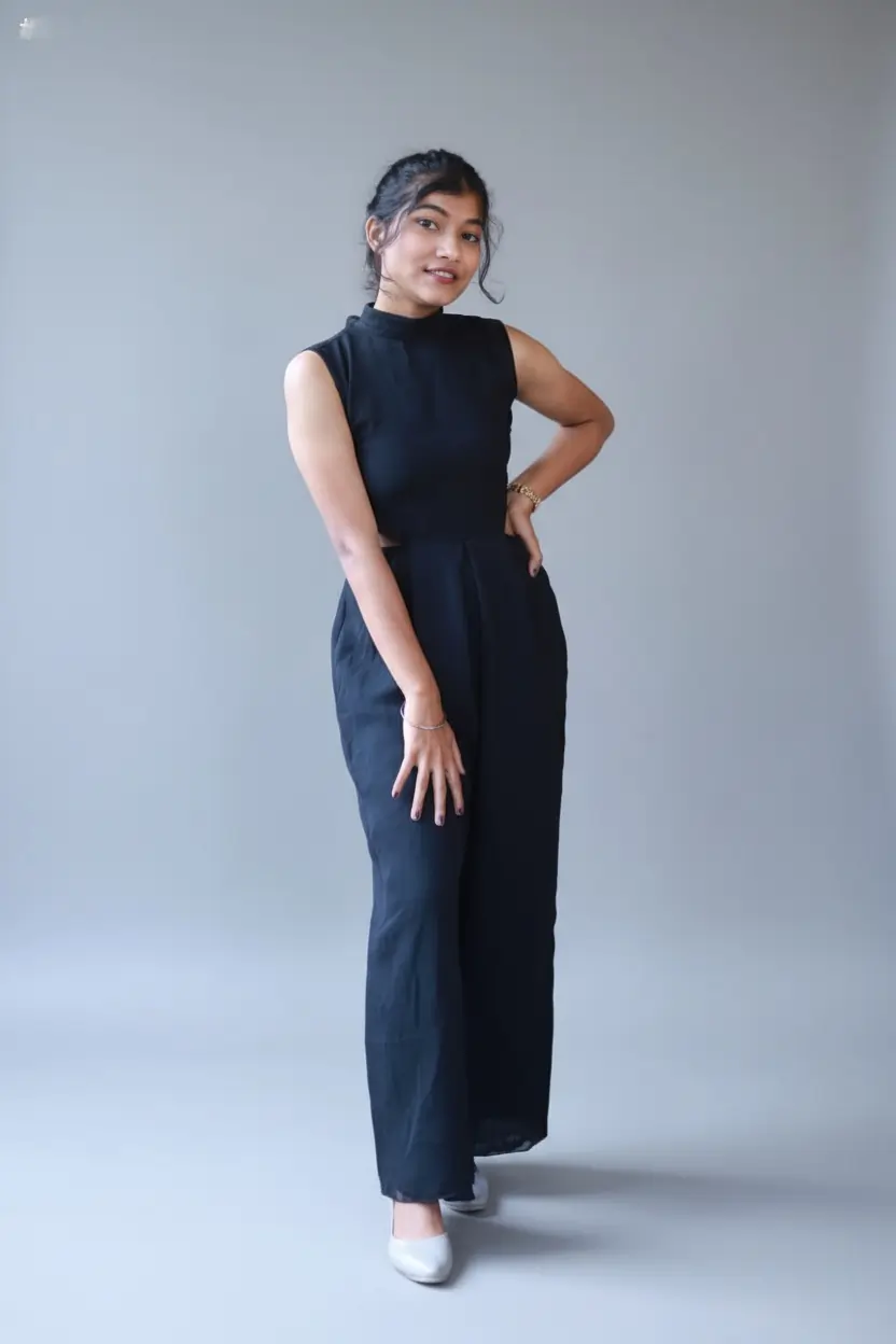 Minimalist Zairona black jumpsuit with flattering fit and modern tailoring.